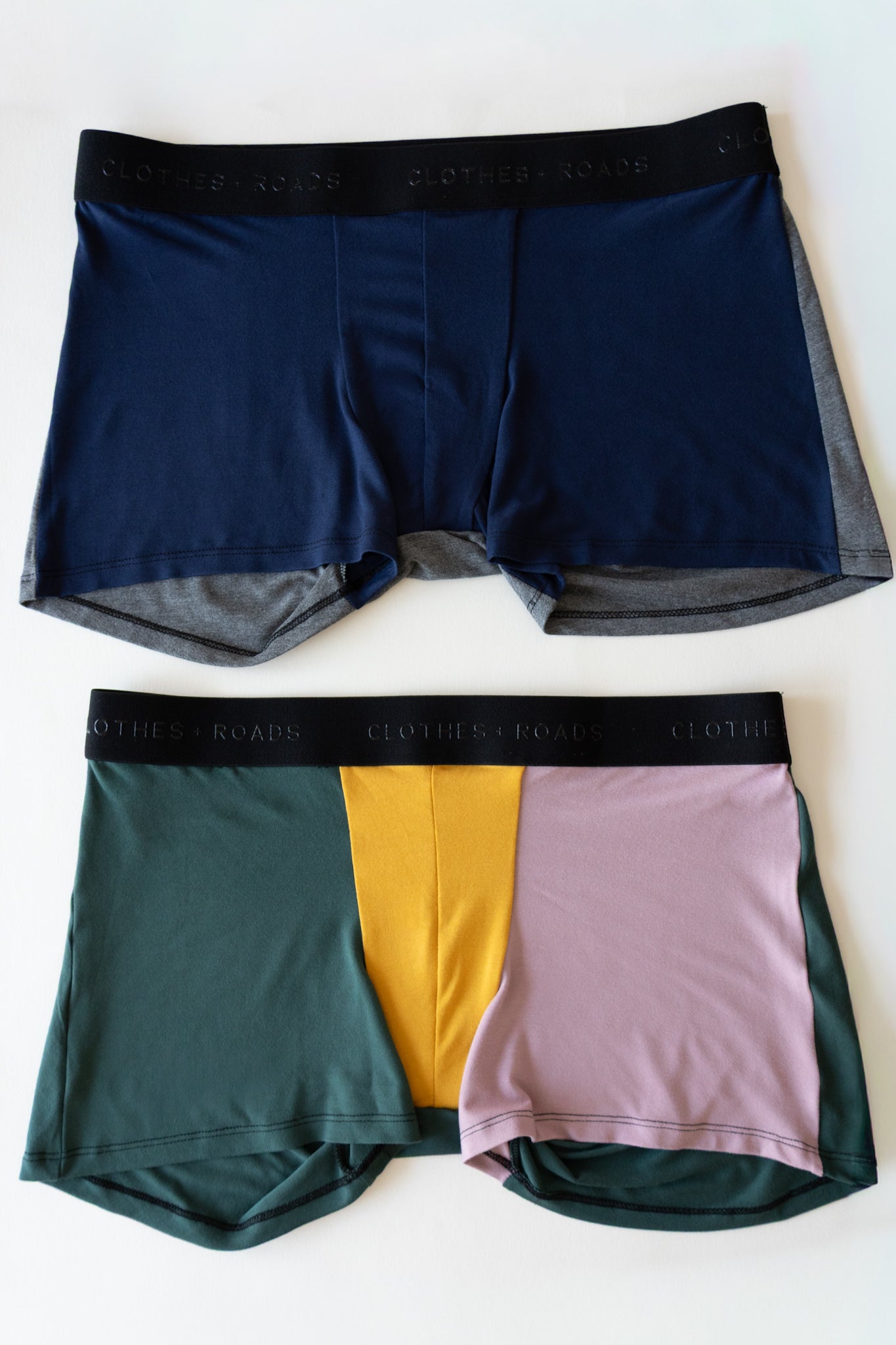 Two pairs of men's underwear in different colors on a white background