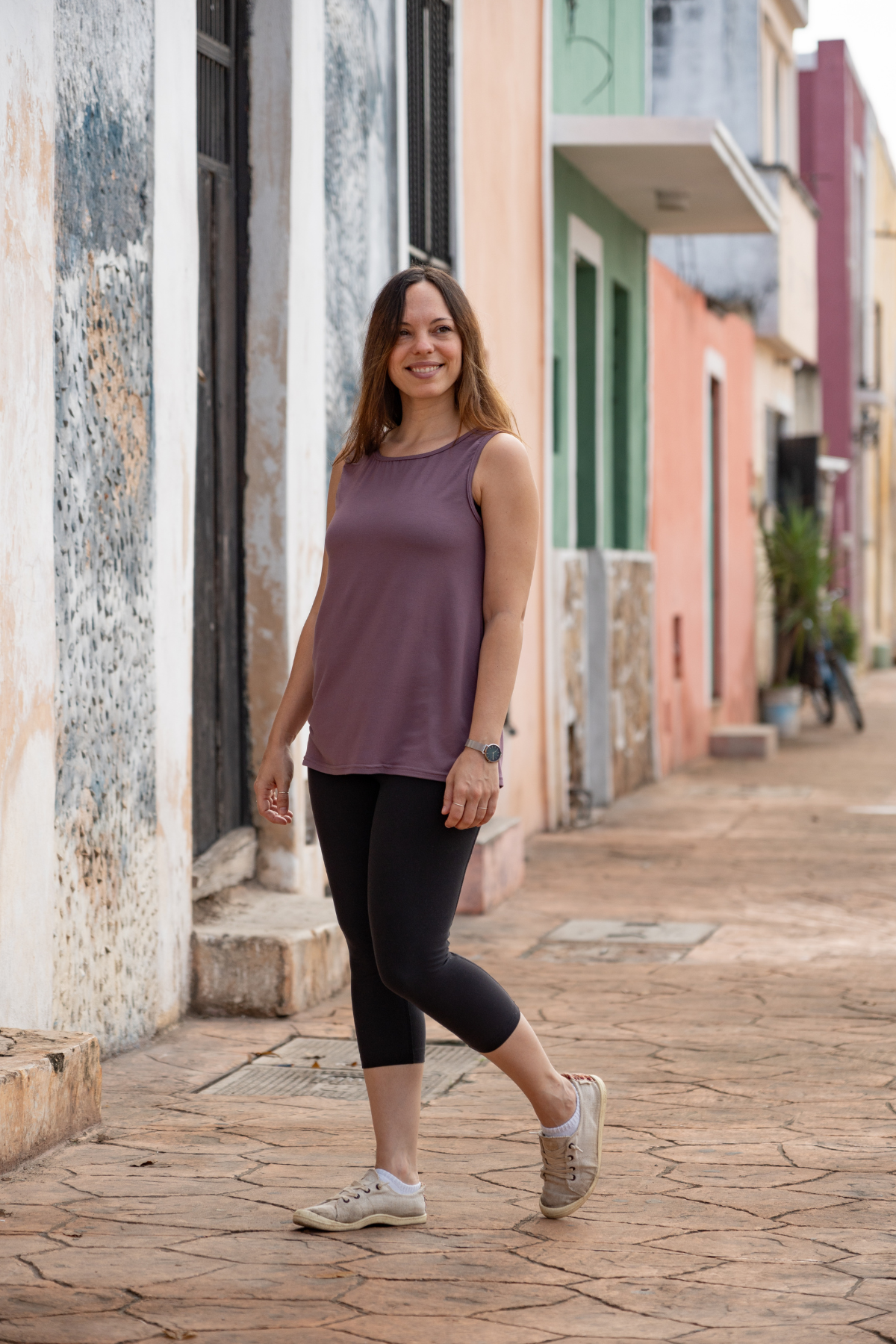 Woman wearing the lavender reversible bamboo camisole, front view.
