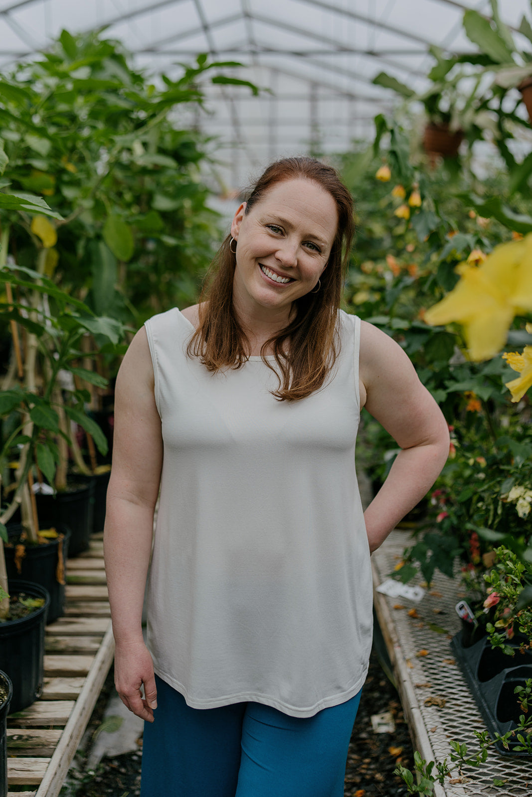 Woman wearing the ivory reversible bamboo camisole, front view.