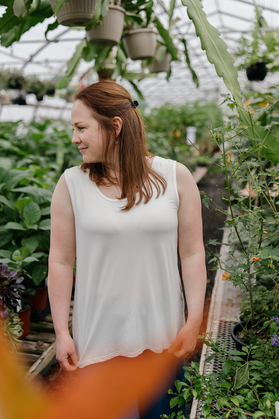 Woman wearing the ivory reversible bamboo camisole, front view with scoopneck