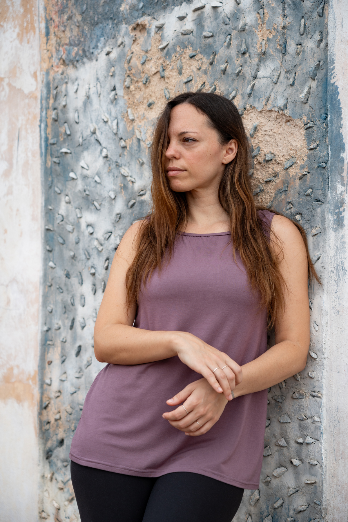 Close-up of a woman wearing the lavender reversible bamboo camisole, front view.