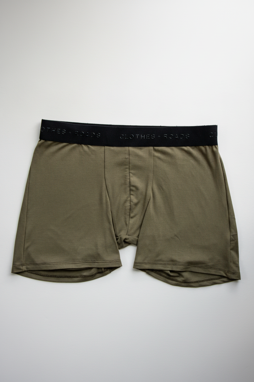Olive green boxer briefs with a black waistband on a white background