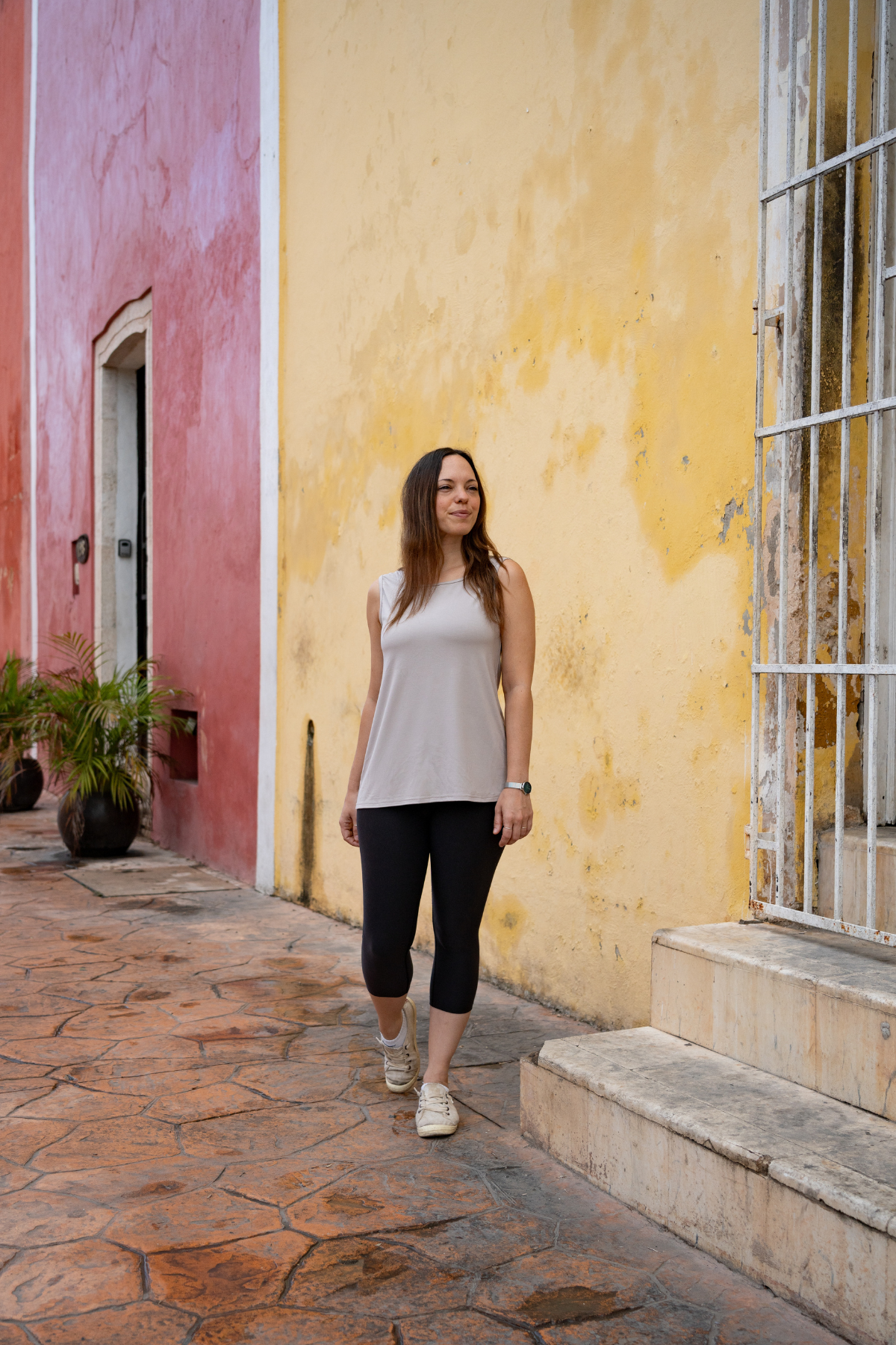 Woman wearing the taupe reversible bamboo camisole, front view.
