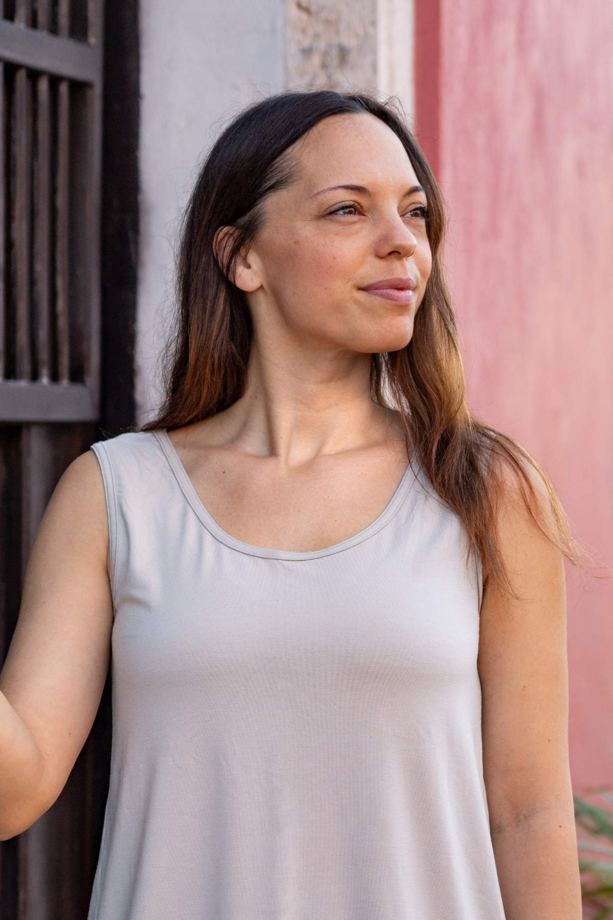Woman wearing the taupe reversible bamboo camisole, front view with scoopneck.
