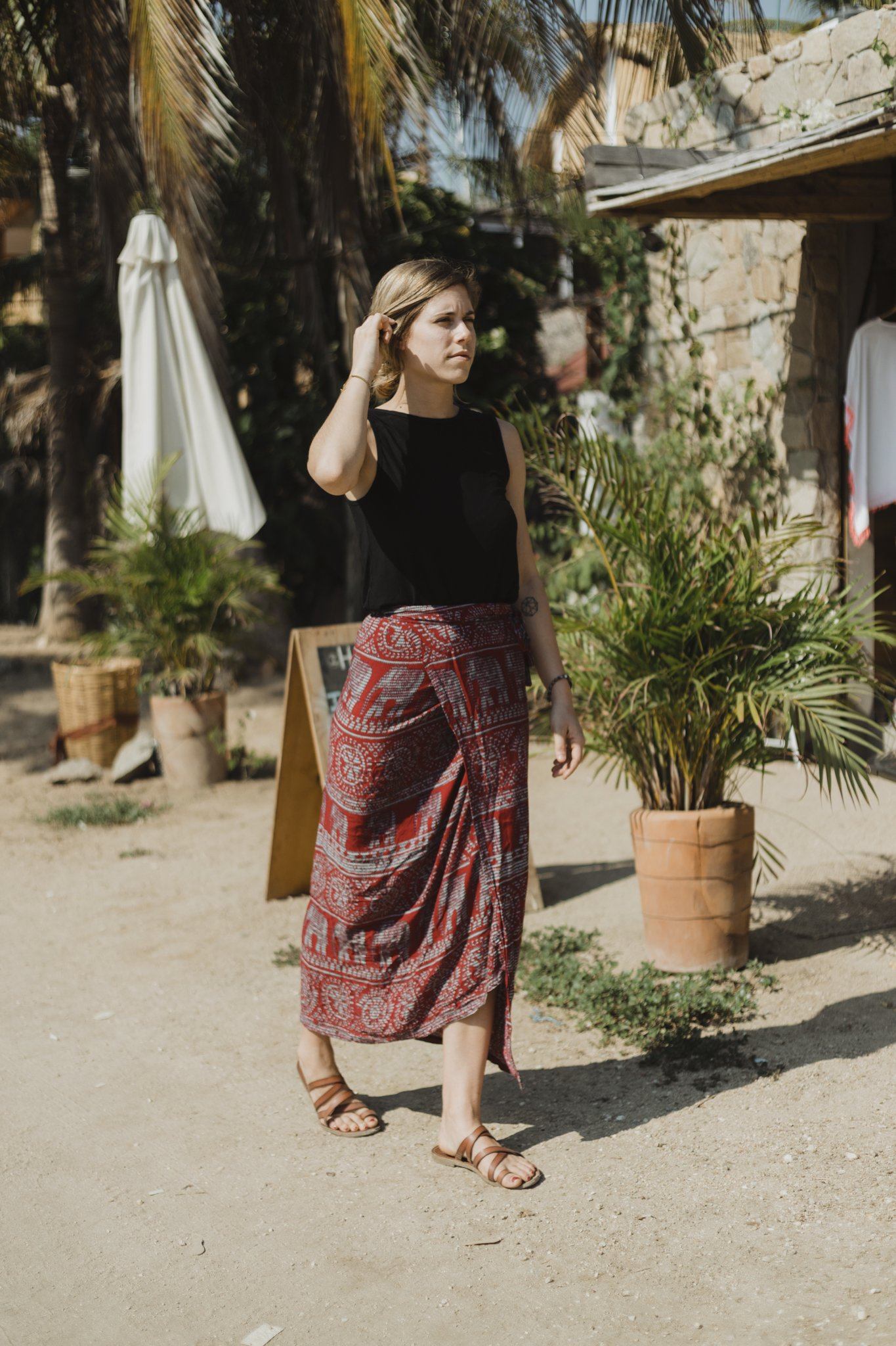 Woman wearing the black reversible bamboo camisole, front view.
