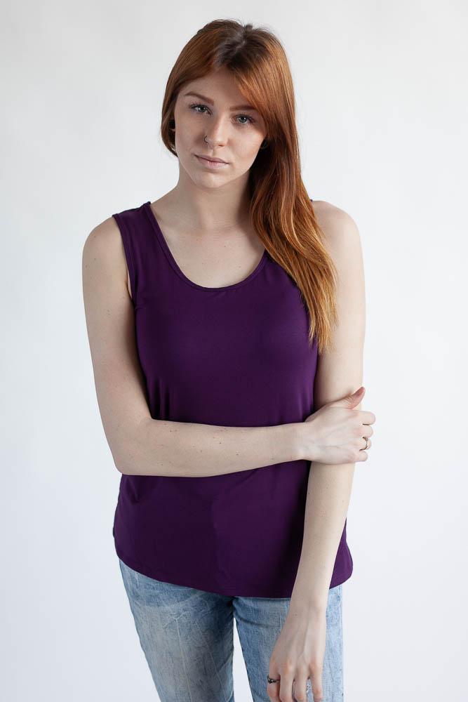Woman wearing the plum reversible bamboo camisole, front view with scoopneck.