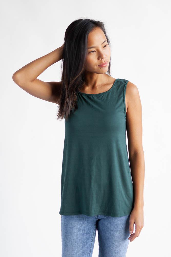 Woman wearing the tropical green reversible bamboo camisole, front view.