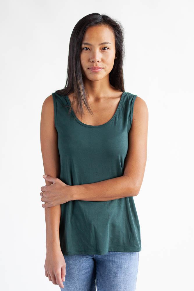 Woman wearing the tropical green reversible bamboo camisole, front view with scoopneck
